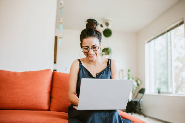 Woman Working Online On Laptop At Home