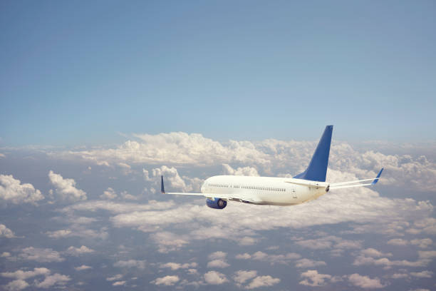 istock Passenger jet airplane flying above clouds 1170363271
