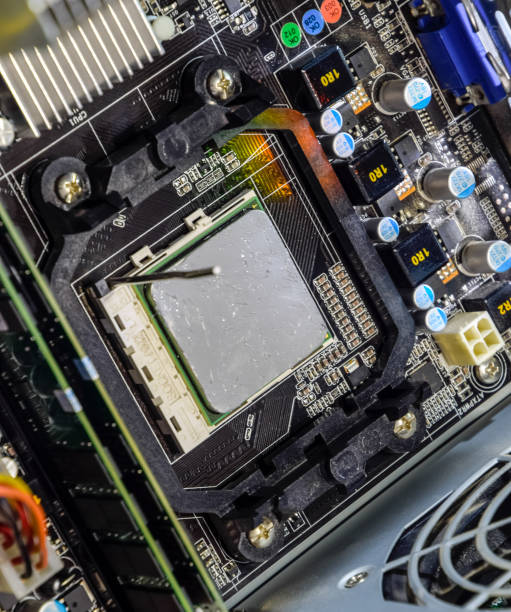 istock The processor of the computer with the thermal paste applied on it. Details of the computer's system unit. 1170363511