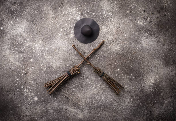 istock Halloween background with witches broom 1170369224