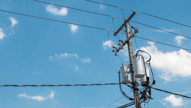 istock Power line pole with a transformer on it. Typical wooden post from USA 1170370331
