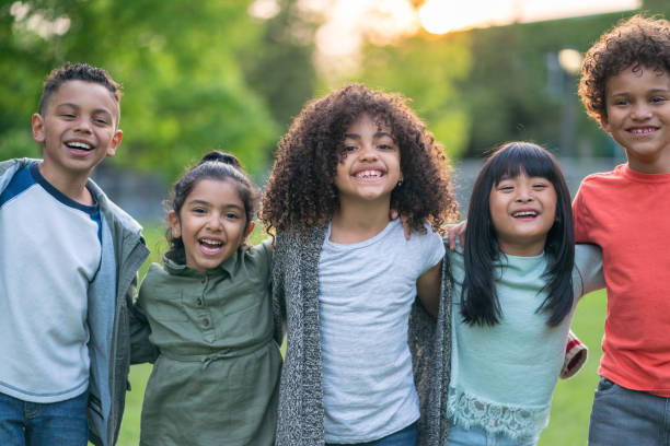 istock A group of smiling kids in the park 1170370970