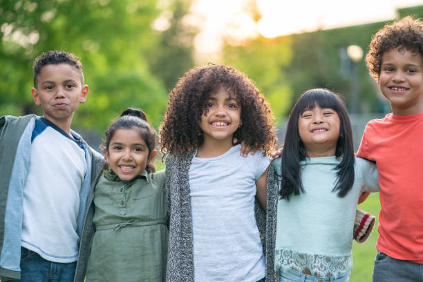 istock A group of smiling kids in the park 1170370971