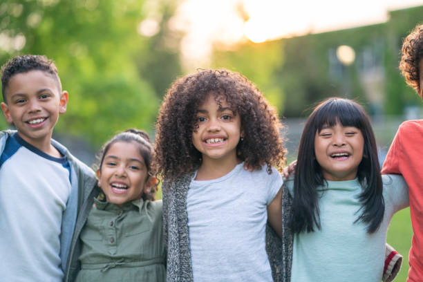 istock A group of smiling kids in the park 1170370973