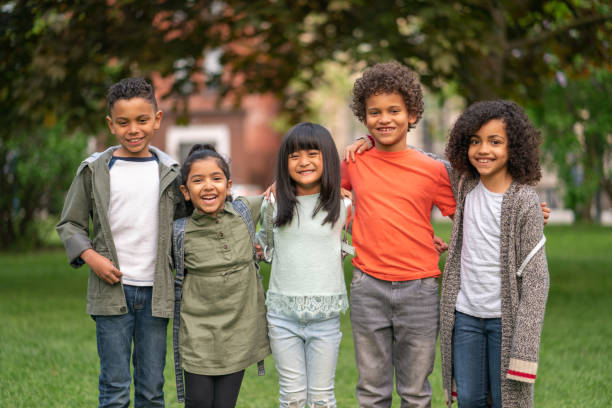 istock A group of smiling kids in the park 1170370992