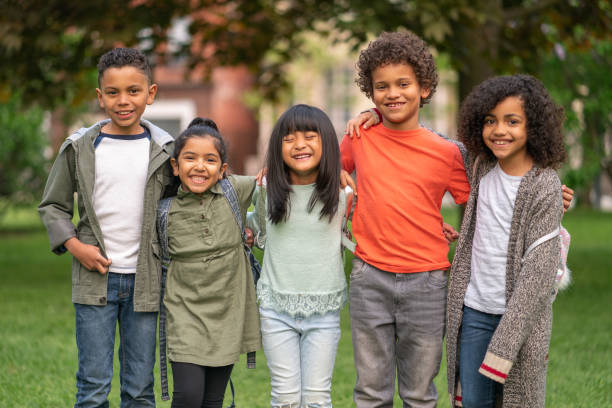 istock A group of smiling kids in the park 1170370995