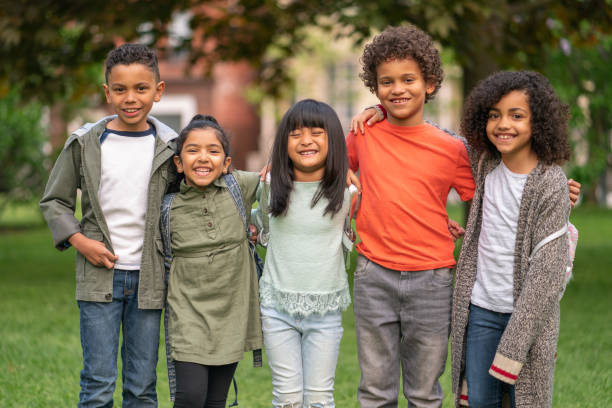 istock A group of smiling kids in the park 1170370997