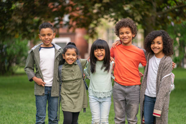 istock A group of smiling kids in the park 1170371002