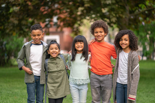 istock A group of smiling kids in the park 1170371015