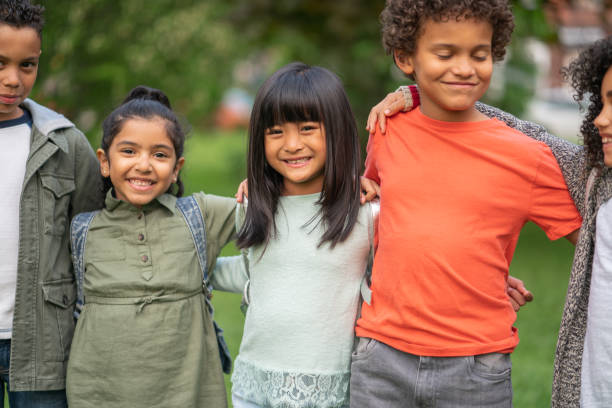 istock A group of smiling kids in the park 1170371019