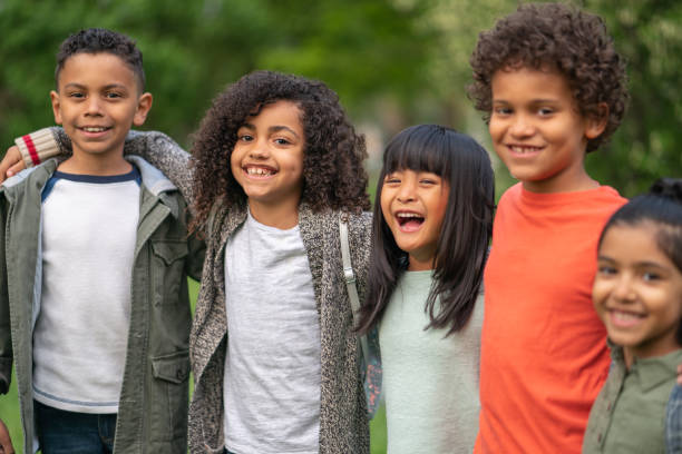istock A group of smiling kids in the park 1170371021