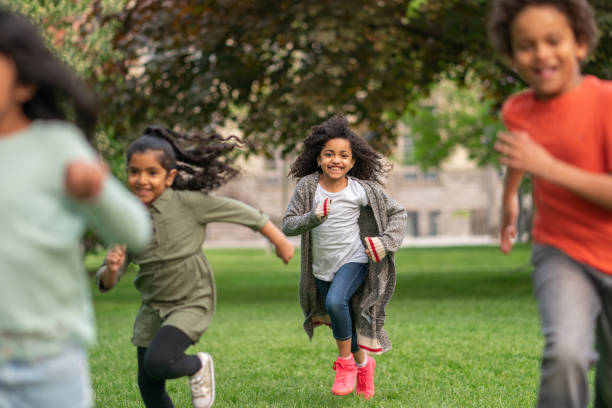 istock Kids running through the park 1170371030
