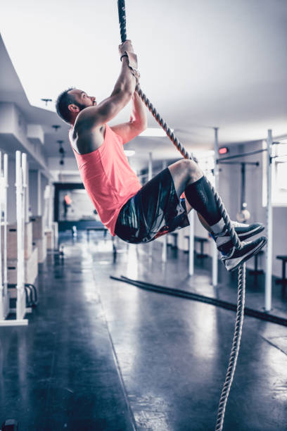 istock Male Showing Perfect Form In Rope Climbing Exercises 1170376999