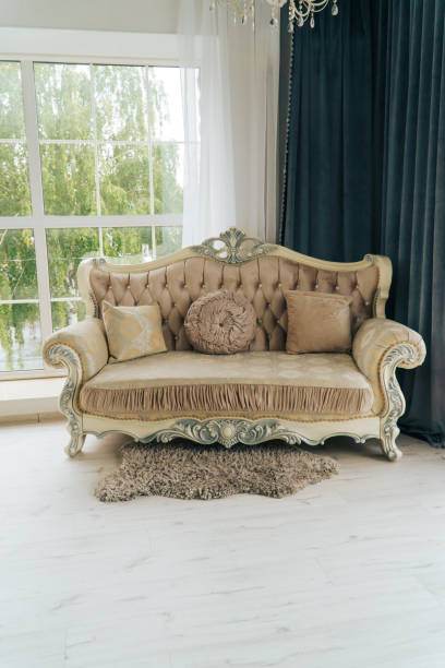 istock beautiful expensive beige sofa against a white wall in an empty room 1170377001