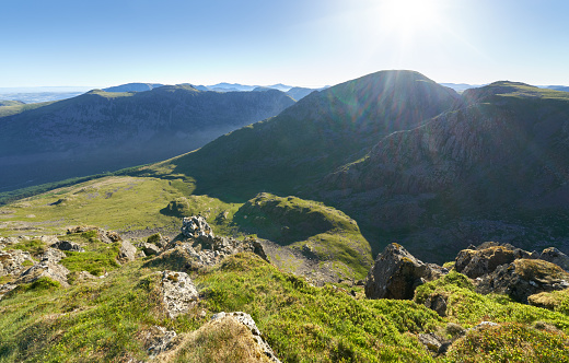 Sunrise over Ennerdale from Scoat Fell with views of Pillar from In the English Lake District, UK.