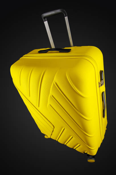 istock Suitcase isolated on black background, clipping path. 1170377435