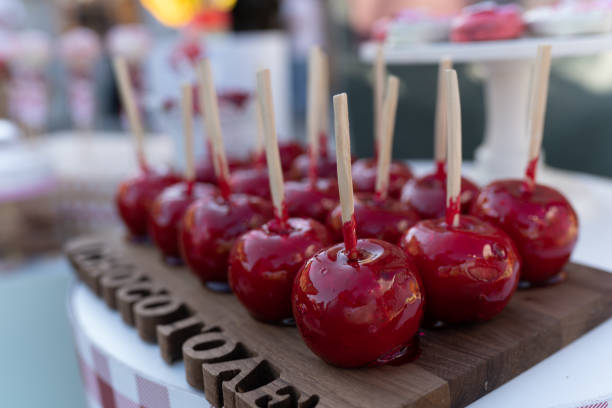 Sweet red taffy candy apples on sticks