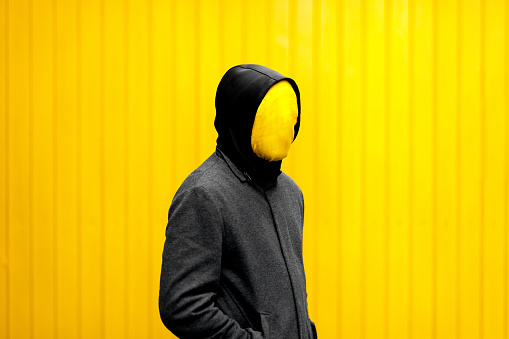 Yellow head man wearing jacket.