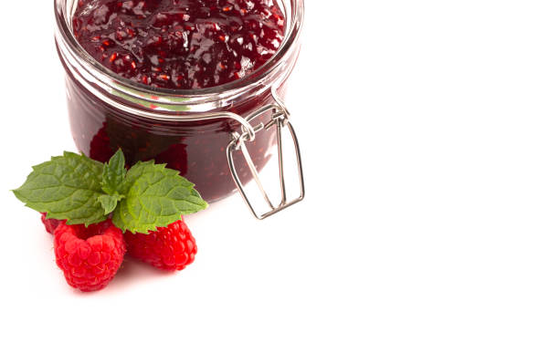 istock A Jar of Homemade Raspberry Jam Isolated on a White Background 1170382908