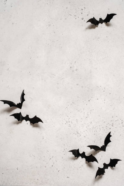 istock halloween decoration concept - black bats on white background 1170382925