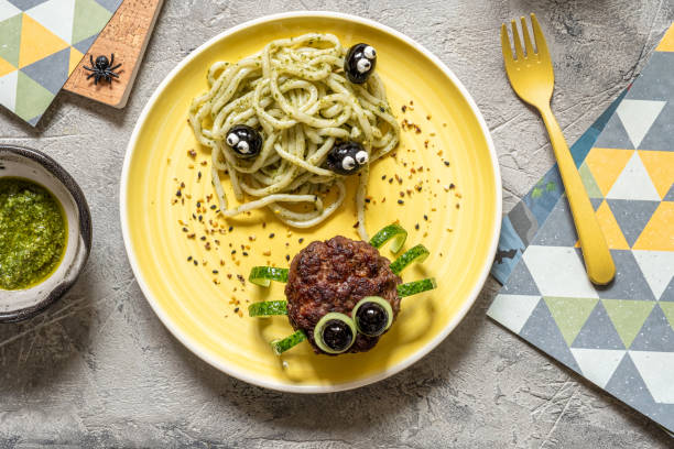 Cutlet look like a spider with pesto pasta for Halloween