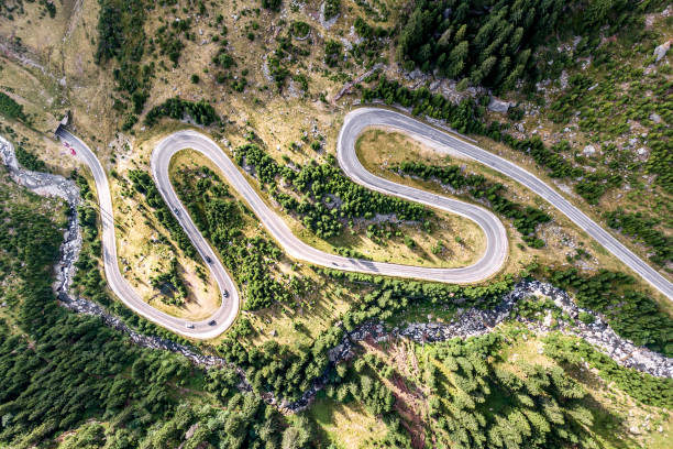 istock winding road in the mountains, aerial view 1170384071