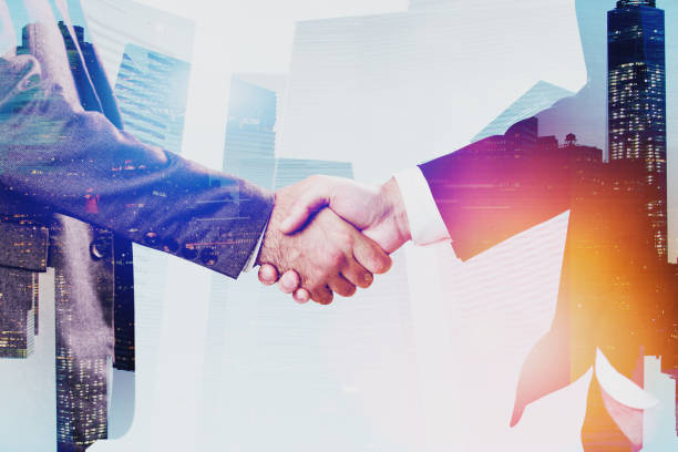 istock Close up of two businessmen shaking hands 1170384209