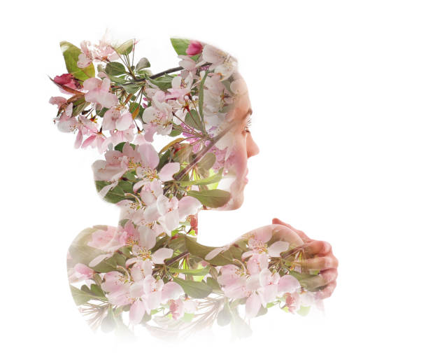 istock Multiple Exposure of woman morphing into apple blossoms 1170384848
