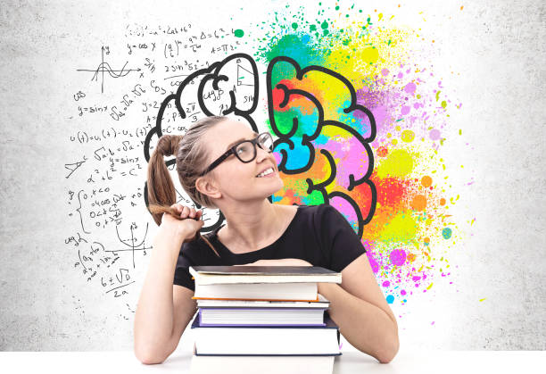 istock Smiling schoolgirl with books, brainstorm 1170386022