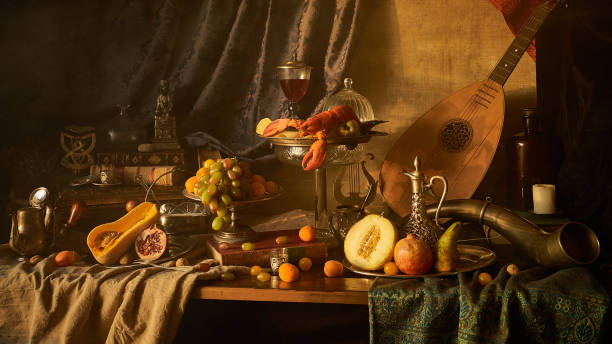 Still life with lobster A classic still-life in the Dutch old masters painting style with lobster, fruits on a silver, platter, silver carafe. old books , glass of wine, hunting horn and guitar lute . baroque stock pictures, royalty-free photos & images
