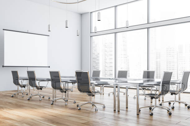 istock White meeting room with projection screen 1170386064