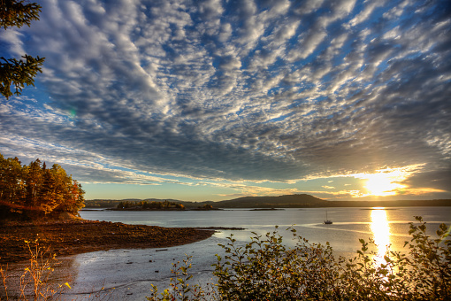 A brilliant sunrise on the banks of the St. Croix River in Saint Croix Island International Historic Site in Maine.