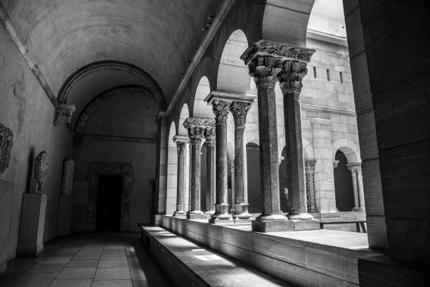Cloister with areches and columns in NYC NEW YORK CITY, NY, USA - JULY 3RD 2019 - European medieval cloister in Washington heights in Manhattan (NYC) black and white travel travel destinations monk stock pictures, royalty-free photos & images