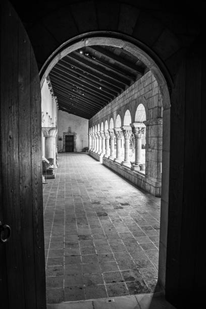 Cloister with areches and columns in NYC NEW YORK CITY, NY, USA - JULY 3RD 2019 - European medieval cloister in Washington heights in Manhattan (NYC) black and white travel travel destinations monk stock pictures, royalty-free photos & images