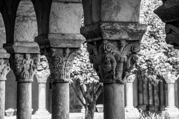 Cloister with areches and columns in NYC NEW YORK CITY, NY, USA - JULY 3RD 2019 - European medieval cloister in Washington heights in Manhattan (NYC) black and white travel travel destinations monk stock pictures, royalty-free photos & images