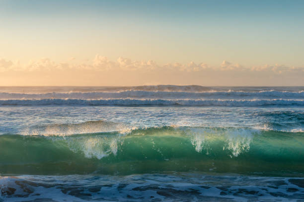 istock Turquoise blue transparent ocean wave at sunrise 1170400302