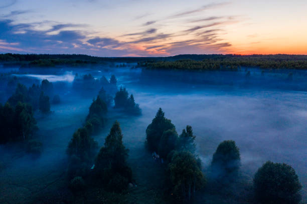 istock morning fog in layers hangs over the field and forest 1170400399