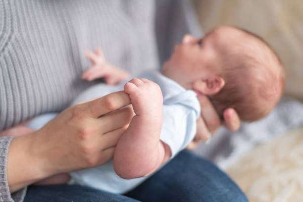 istock A baby wrapping its hand around his mothers finger 1170400547