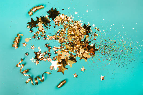istock Golden sparkles on blue background 1170401262