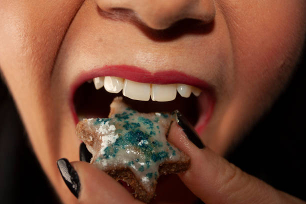istock Healthy and clean teeth ready to eat ginger cookies from a bite 1170406905