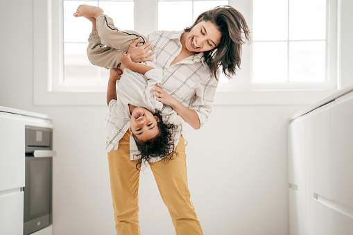 Mom enjoying the time with her son in the kitchen