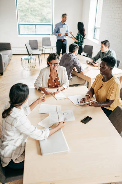 istock Multi-ethnic group negotiating  in a coworking space 1170409535
