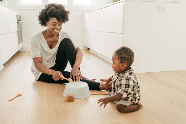 istock Mom playing with baby son 1170409935
