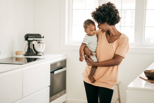 istock Mom playing with baby son 1170409942