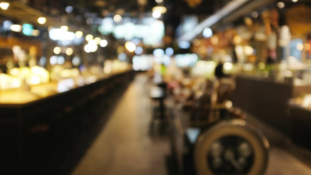 istock Blur or Defocus image of restaurants or Cafeteria ,Customer at restaurant blur background with bokeh for use as Background