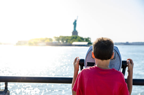 istock Kid looking at Statue of Liberty 1170417579