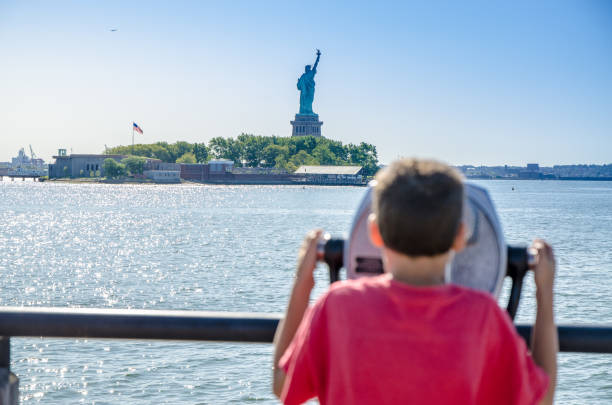 istock Kid looking at Statue of Liberty 1170417645