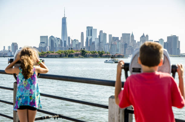 istock Kids looking at Manhattan Island 1170418314