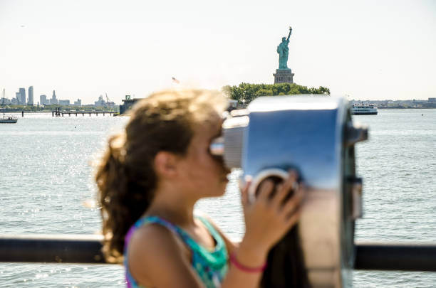 istock Kid looking at Manhattan Island 1170418514