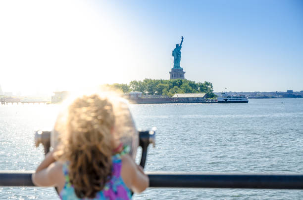 istock Kid looking at Statue of Liberty 1170418626
